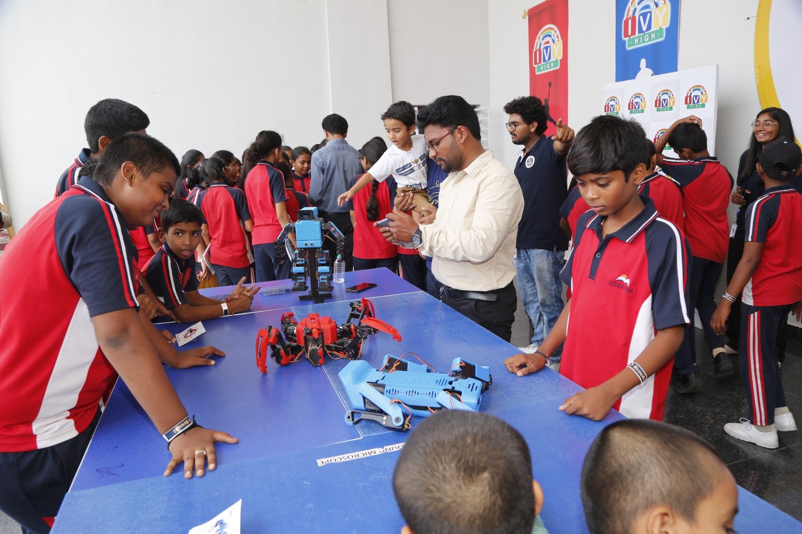 Students discovering robotics with a facilitator
